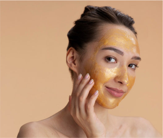 Woman applying facial mask