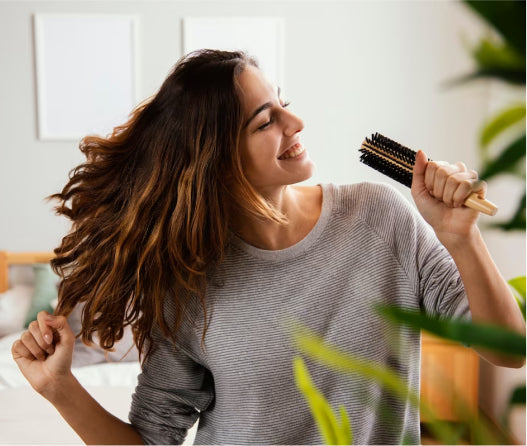 Woman brushing hair						